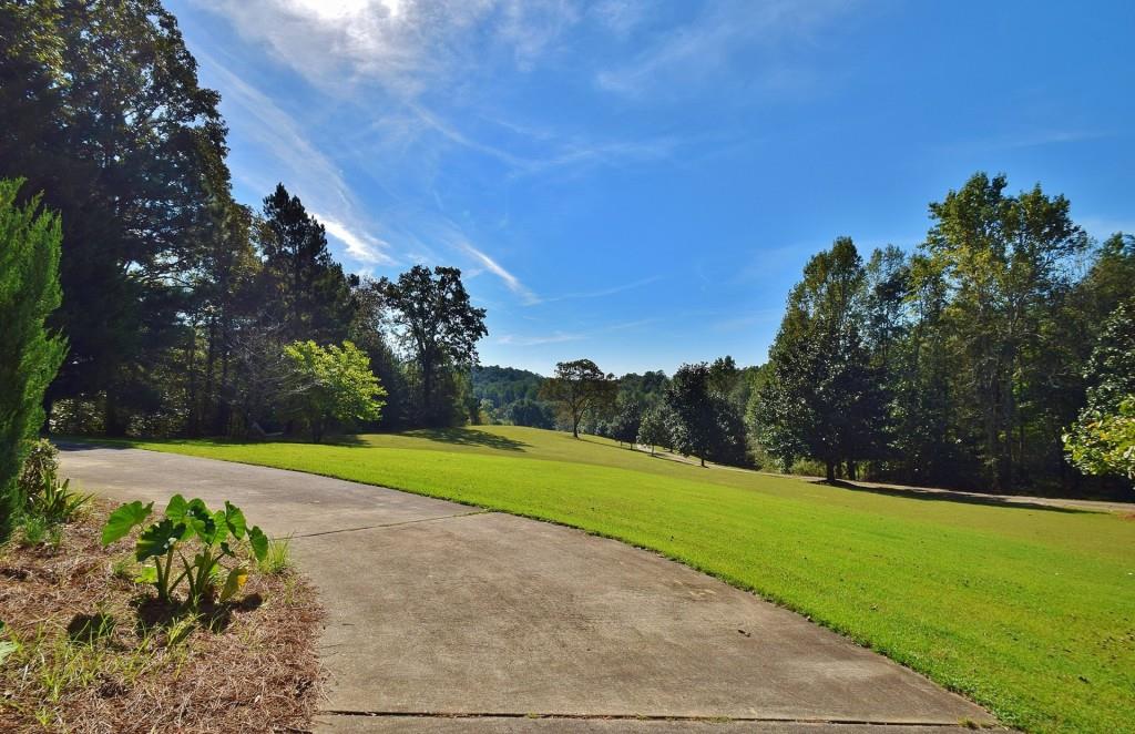6057 Walden Pond Road Gainesville, GA 30506 - Photo 1 of 1 a view of a park with large trees