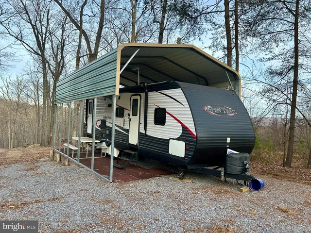 a backyard of a house with yard and retail shops