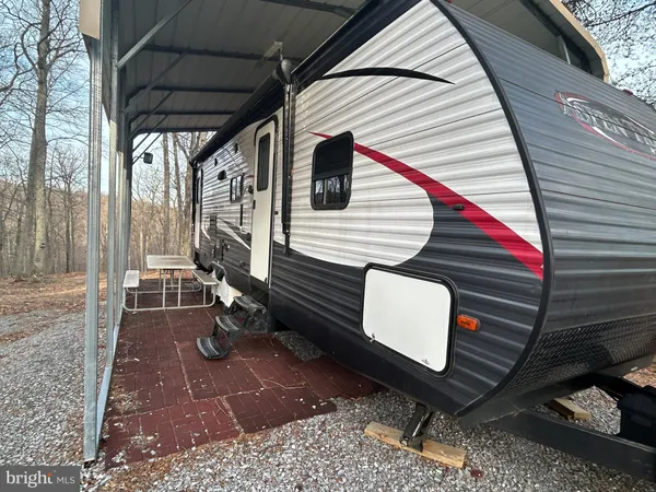 a view of a livingroom with furniture and a flat screen tv