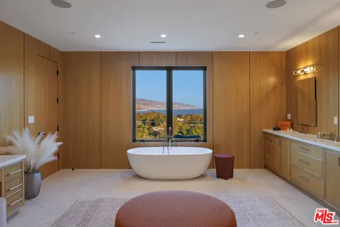 a living room with furniture fireplace and flat screen tv