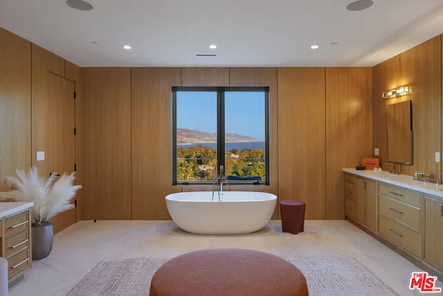 a living room with furniture fireplace and flat screen tv