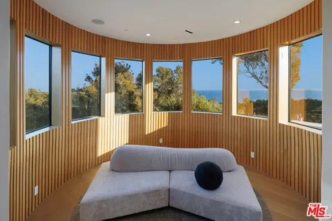 a living room with furniture and a projector