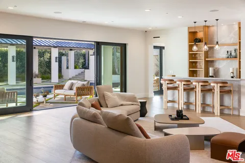 a living room with fireplace furniture and a flat screen tv