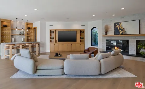 a bedroom with a large bed and a couch