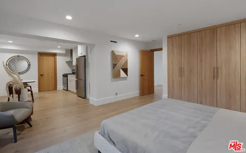 a kitchen with stove a sink and cabinets