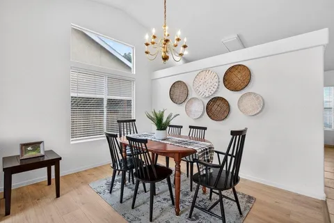 a view of a dining room and chandelier