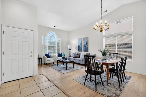 a view of a dining room with furniture window and outside view