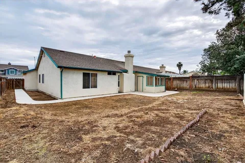 a house view with a garden space
