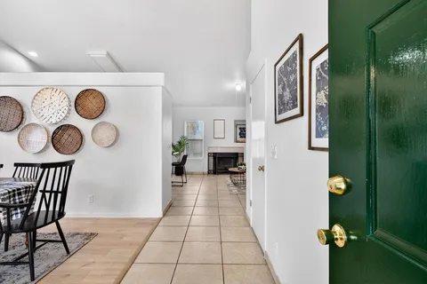 a view of living room kitchen and hardwood floor