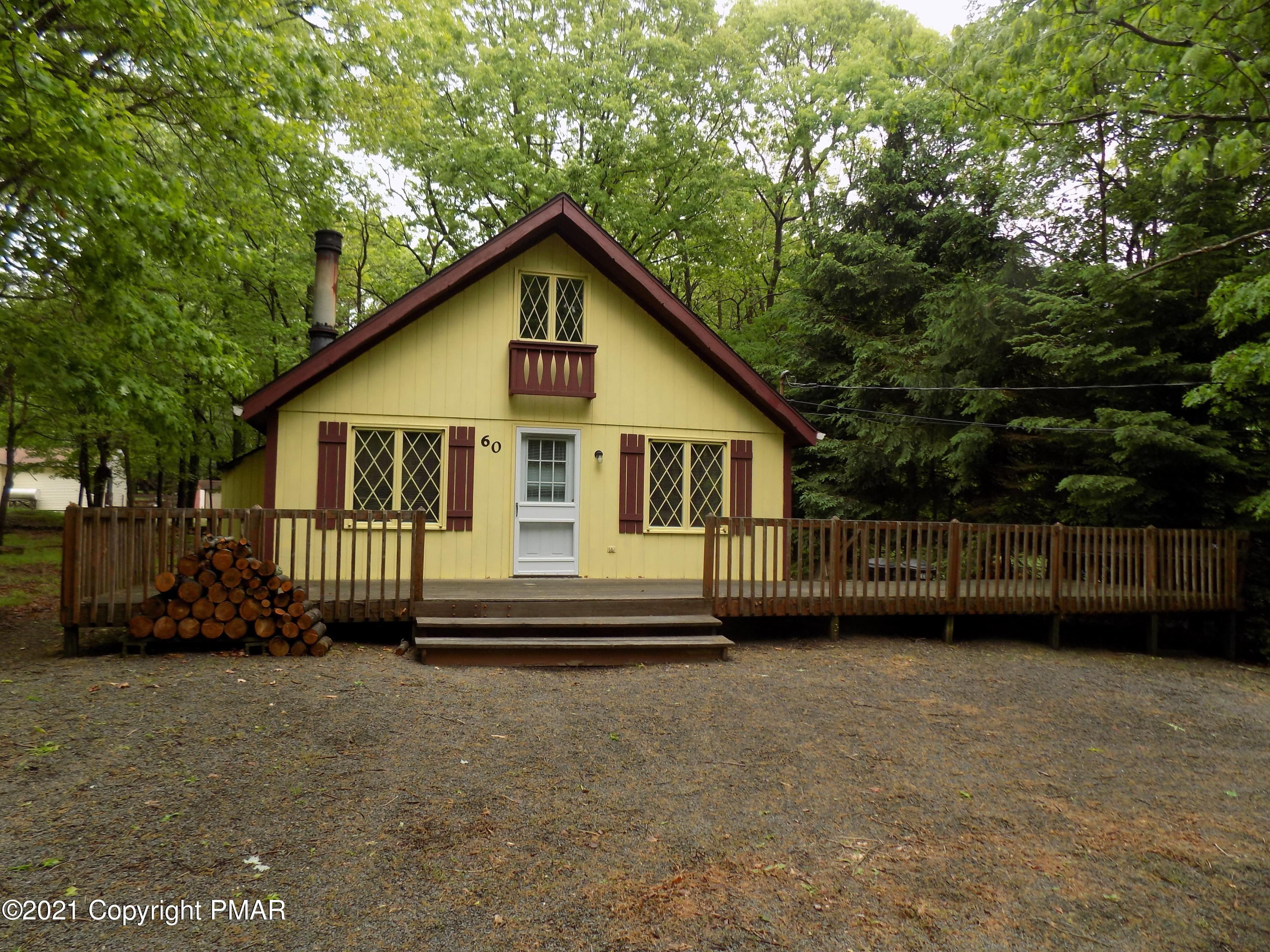 60 Buckhill Road Albrightsville, PA 18210 - Photo 1 of 13 a front view of a house with a garden