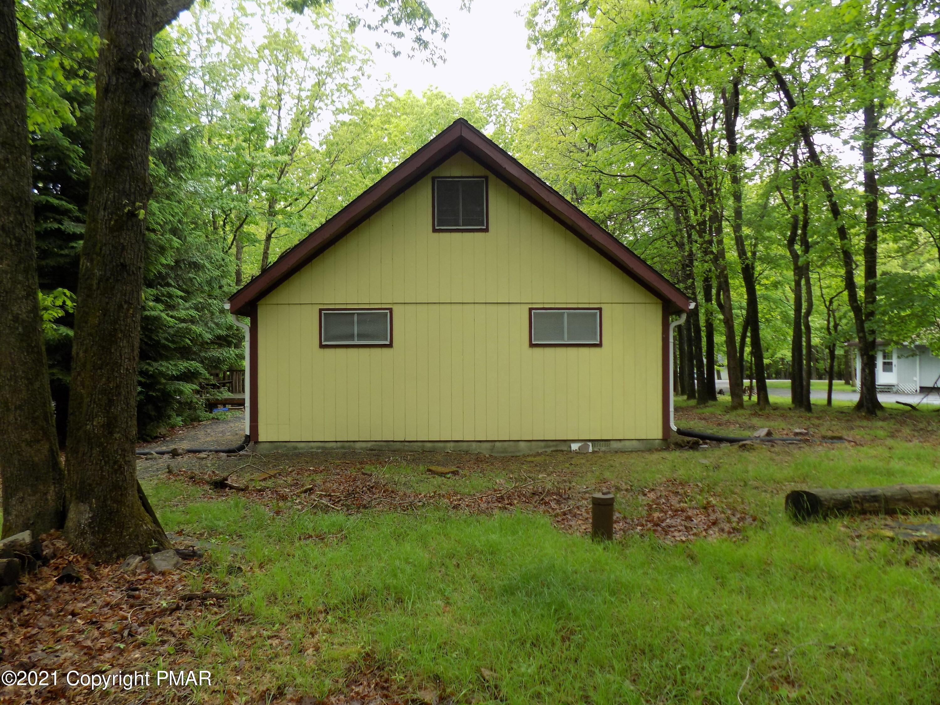60 Buckhill Road Albrightsville, PA 18210 - Photo 12 of 13 a view of a yard in front of a house with large trees