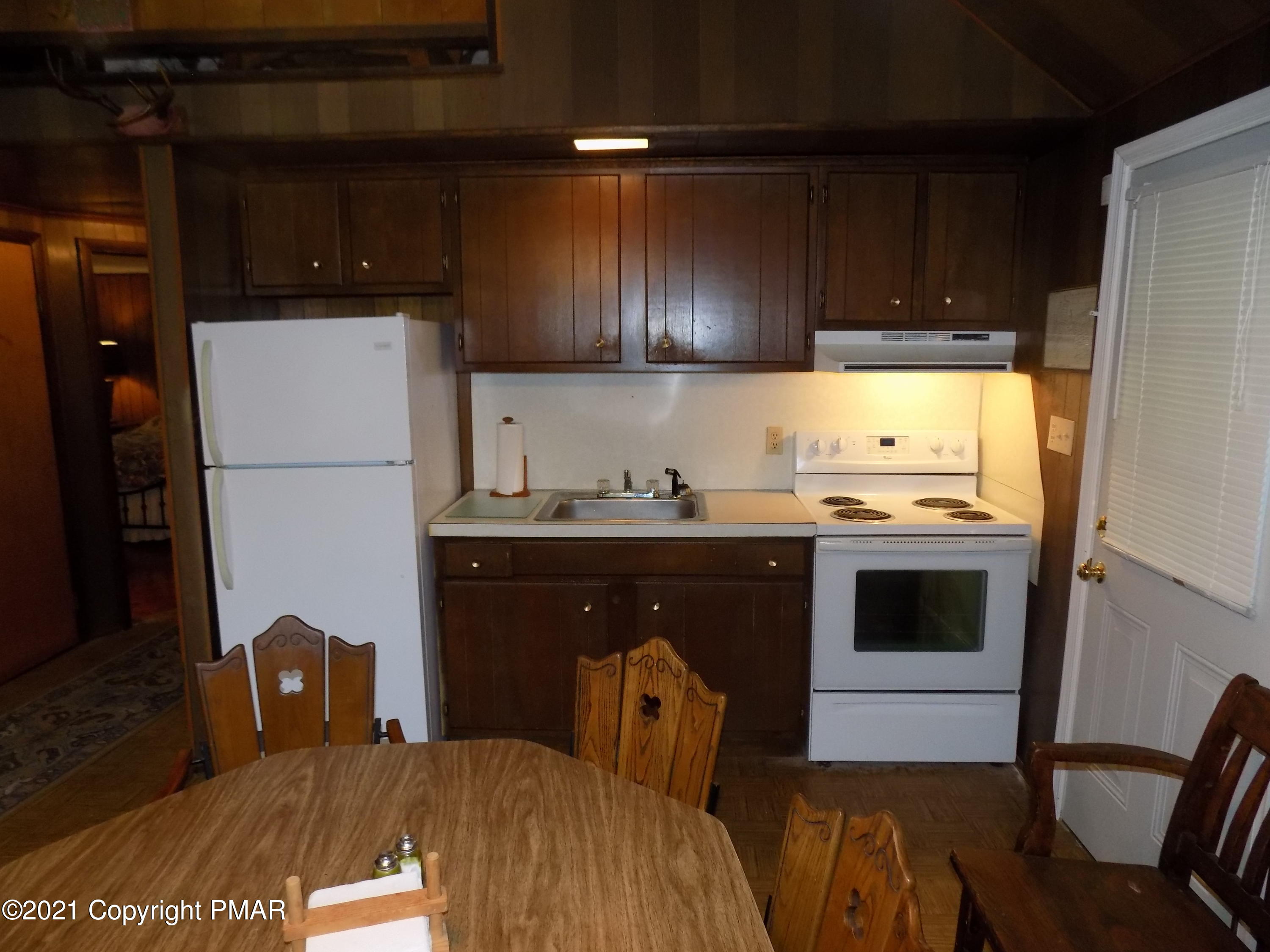 60 Buckhill Road Albrightsville, PA 18210 - Photo 3 of 13 a kitchen with a refrigerator and a stove top oven