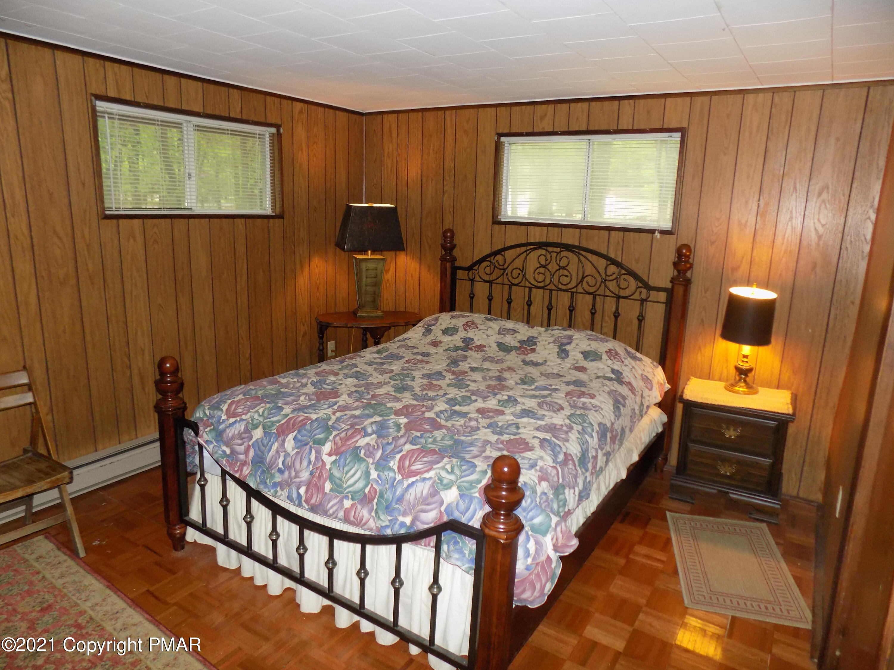 60 Buckhill Road Albrightsville, PA 18210 - Photo 6 of 13 a bed sitting in a room next to a window