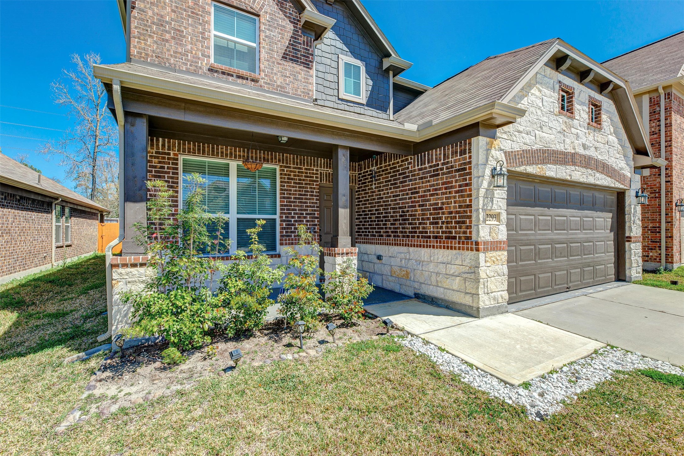 2293 Garden Square Path Spring, TX 77386 - Photo 4 of 32 a front view of a house with garden