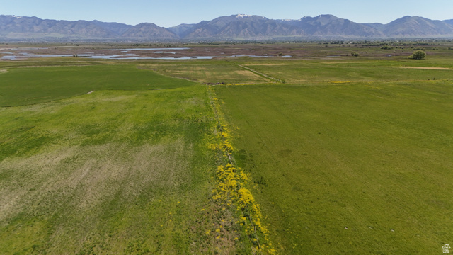320 South 5400 West Logan, UT 84321 - Photo 23 of 42 Expansive green fields featuring natural vegetation and distant mountains