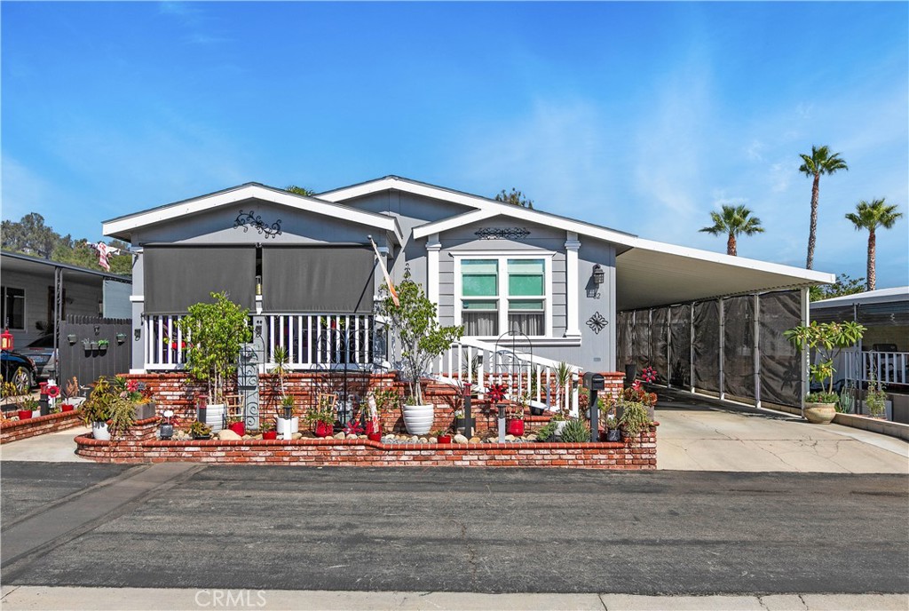 8651 Foothill Boulevard, Unit 82 Rancho Cucamonga, CA 91730 - Photo 1 of 56 a front view of a house