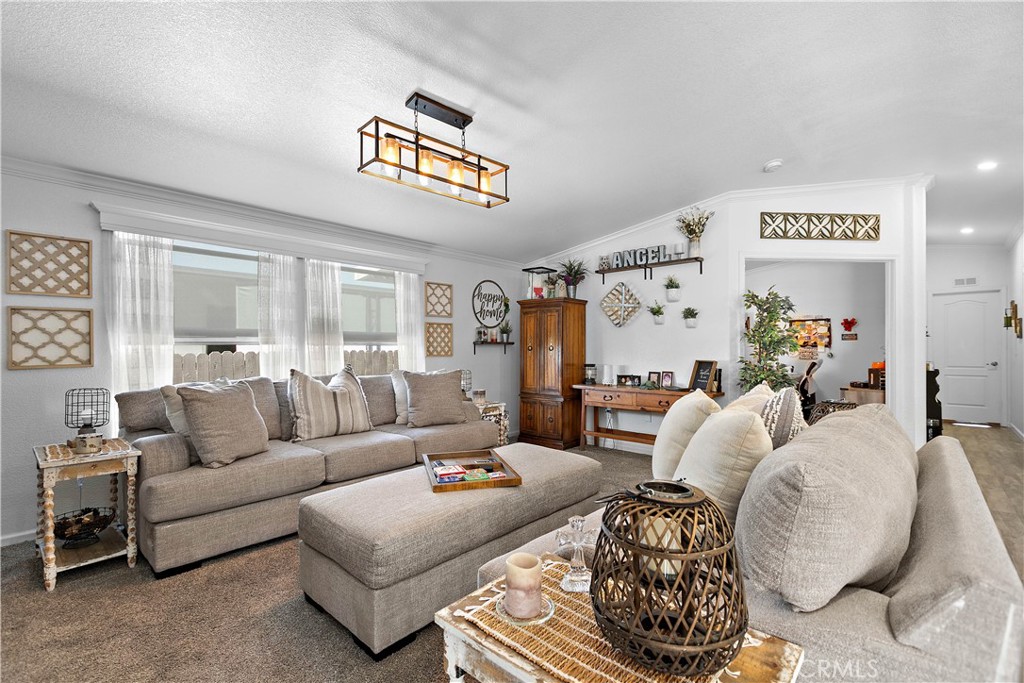 8651 Foothill Boulevard, Unit 82 Rancho Cucamonga, CA 91730 - Photo 15 of 56 a living room with furniture and a large window