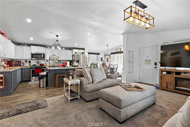 a kitchen with refrigerator and cabinets