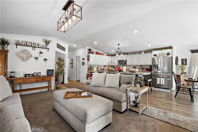 a view of a kitchen and dining area with wooden floor