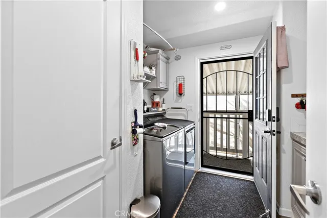 a bedroom with a bed and a lamp on dresser