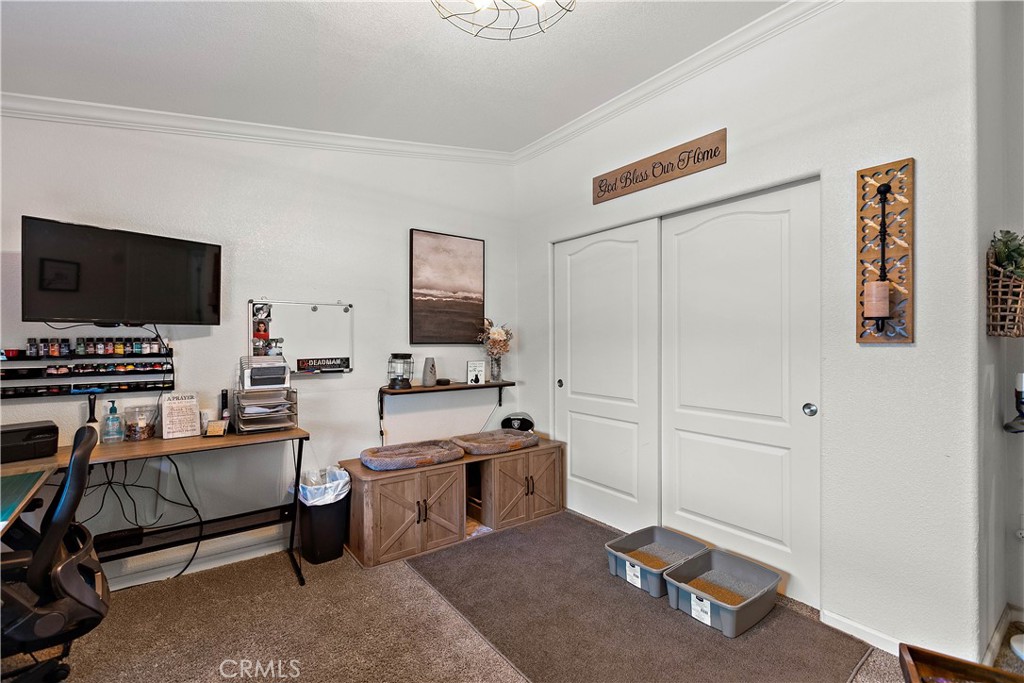 8651 Foothill Boulevard, Unit 82 Rancho Cucamonga, CA 91730 - Photo 32 of 56 a workspace with furniture and flat screen tv