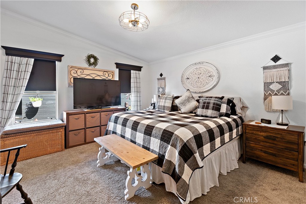 8651 Foothill Boulevard, Unit 82 Rancho Cucamonga, CA 91730 - Photo 34 of 56 a bedroom with a bed and a flat screen tv