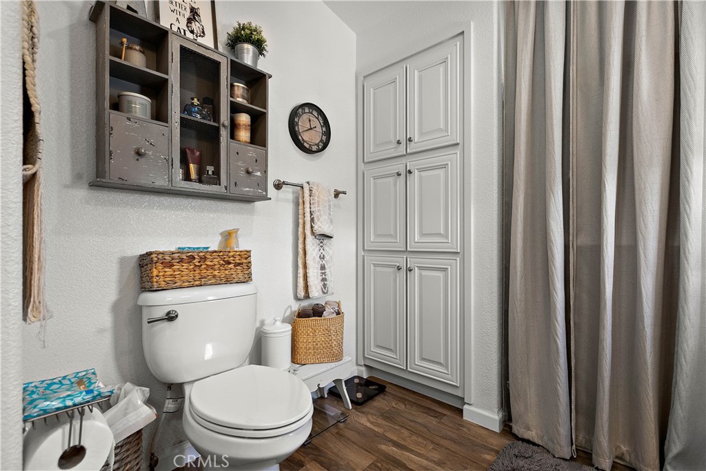 8651 Foothill Boulevard, Unit 82 Rancho Cucamonga, CA 91730 - Photo 38 of 56 a white toilet sitting next to a bathroom sink