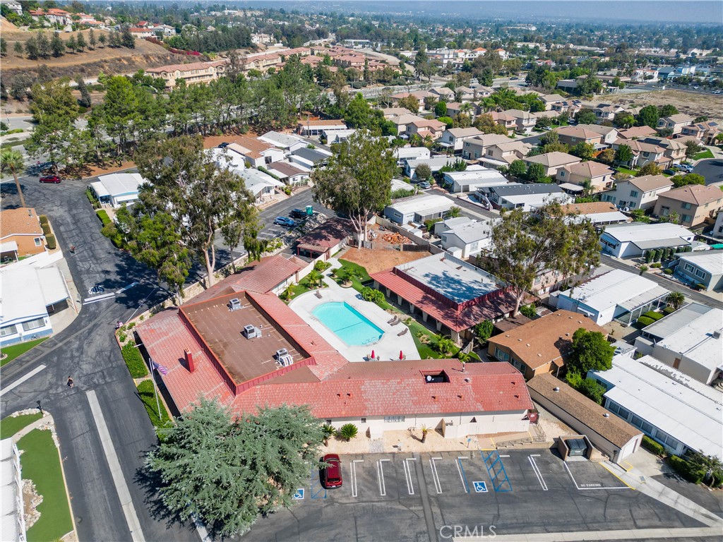 8651 Foothill Boulevard, Unit 82 Rancho Cucamonga, CA 91730 - Photo 4 of 56 an aerial view of a city with lots of residential buildings