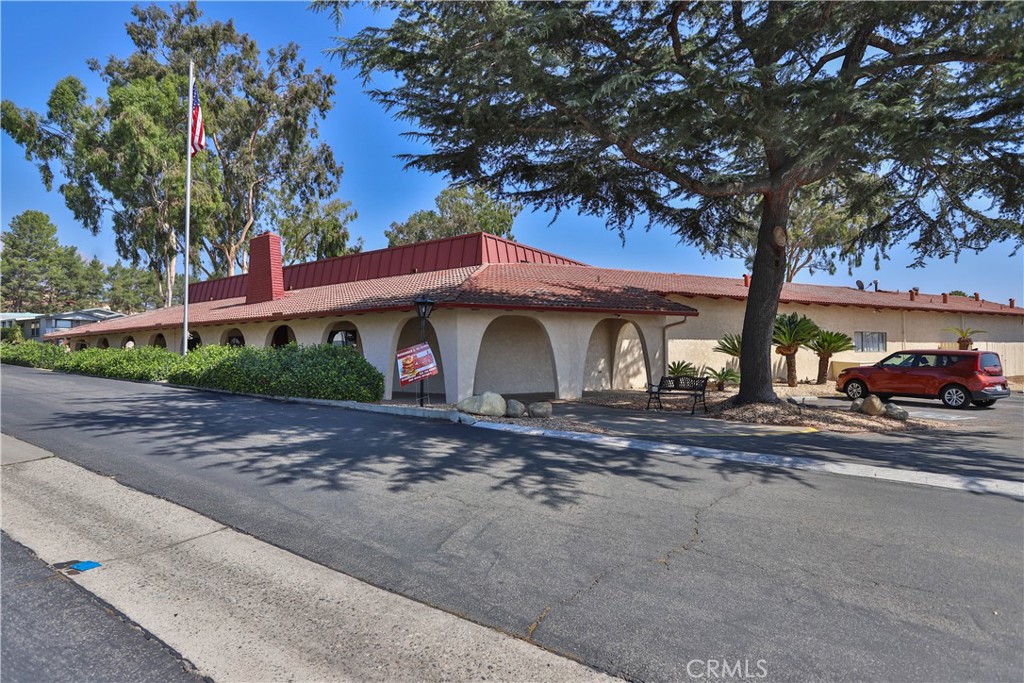 8651 Foothill Boulevard, Unit 82 Rancho Cucamonga, CA 91730 - Photo 46 of 56 a front view of a house with garden
