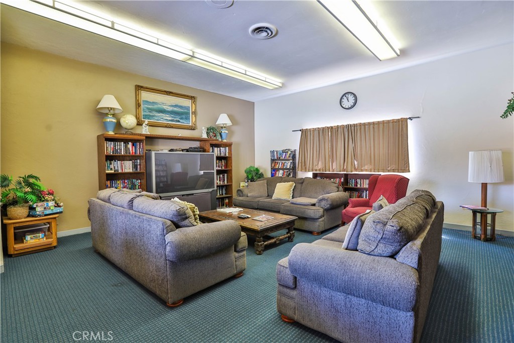 8651 Foothill Boulevard, Unit 82 Rancho Cucamonga, CA 91730 - Photo 50 of 56 a living room with furniture and a flat screen tv