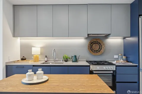 a kitchen with a sink and a stove