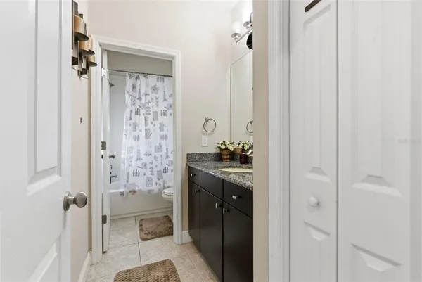 a spacious bathroom with a shower and a sink