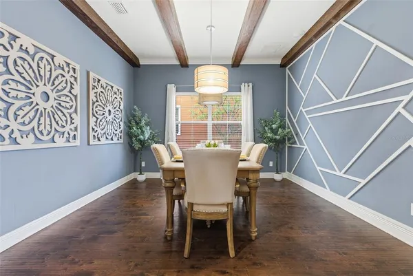 a view of a dining room with furniture window and outside view