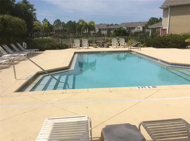 a view of swimming pool from a balcony