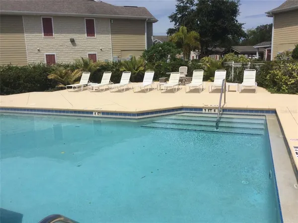 a view of swimming pool with a patio