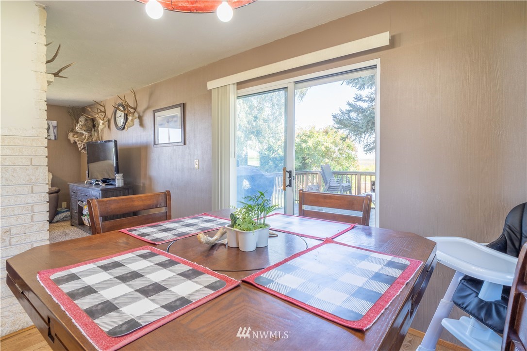 512 Rd P Northeast Moses Lake, WA 98837 - Photo 11 of 39 a living room with furniture a rug and a window