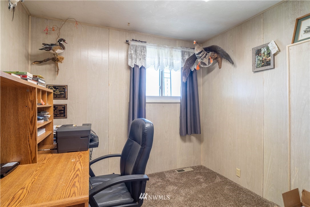 512 Rd P Northeast Moses Lake, WA 98837 - Photo 15 of 39 a view of a workspace with furniture and a chandelier