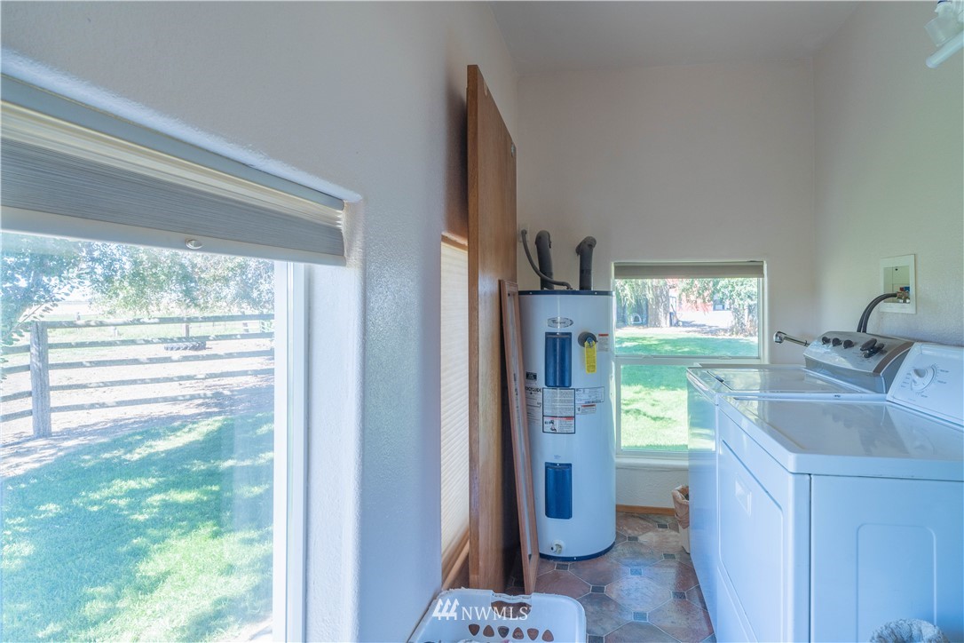 512 Rd P Northeast Moses Lake, WA 98837 - Photo 17 of 39 a kitchen with a refrigerator and a sink