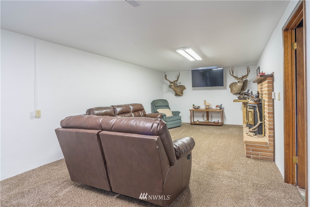 512 Rd P Northeast Moses Lake, WA 98837 - Photo 19 of 39 a living room with furniture and a flat screen tv