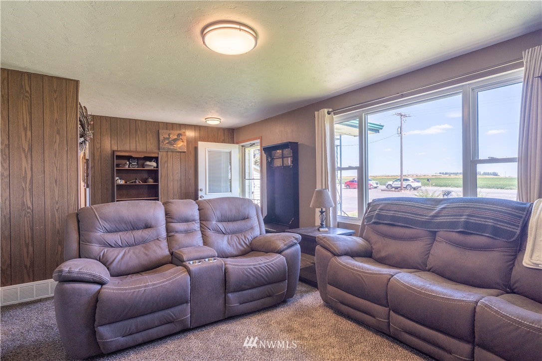 512 Rd P Northeast Moses Lake, WA 98837 - Photo 3 of 39 a living room with furniture ceiling fan and a window