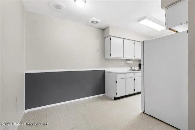 a view of cabinets with wooden floor
