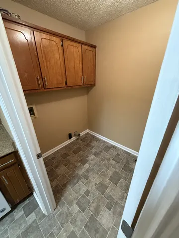 a view of a room with wooden floor and staircase
