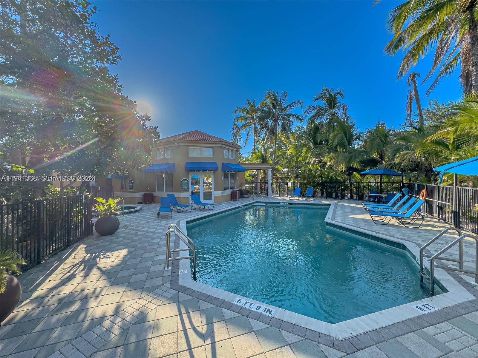 761 North Pine Island Road, Unit 203 Plantation, FL 33324 - Photo 11 of 11 a view of a swimming pool with chairs