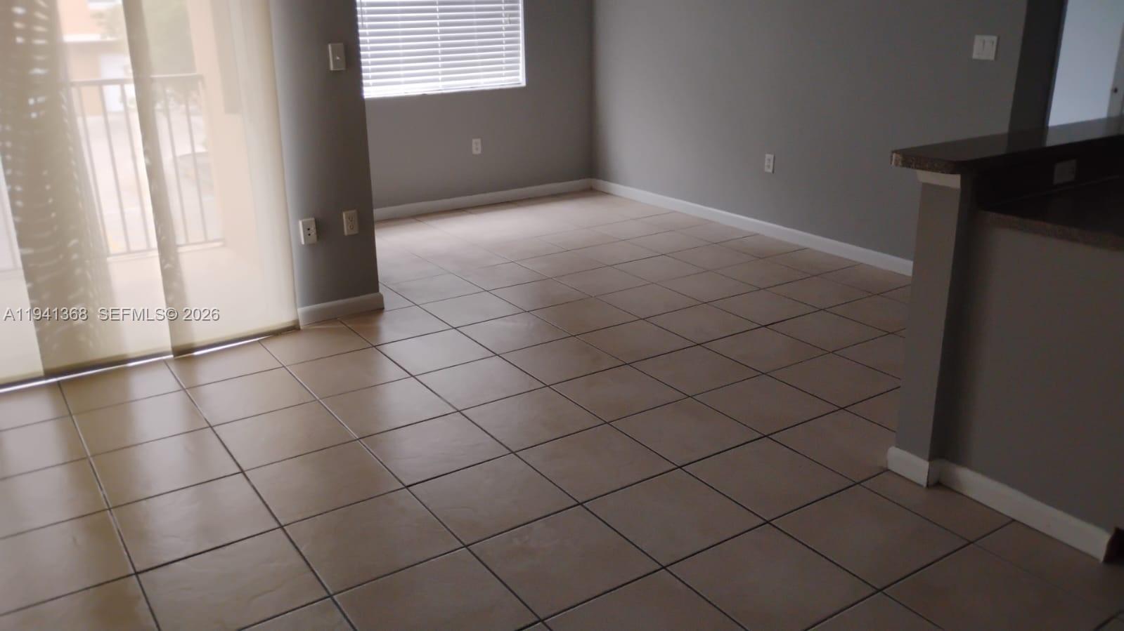 761 North Pine Island Road, Unit 203 Plantation, FL 33324 - Photo 4 of 11 a view of an empty room and a window