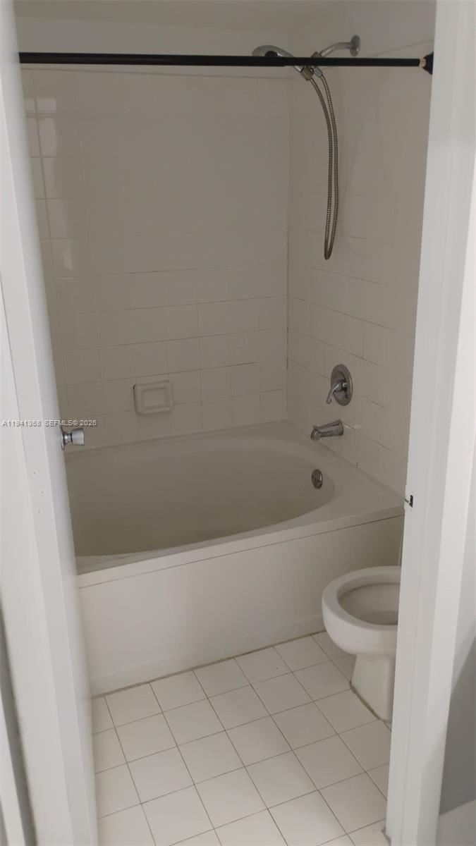 761 North Pine Island Road, Unit 203 Plantation, FL 33324 - Photo 7 of 11 a bathroom with a shower a toilet and a shower
