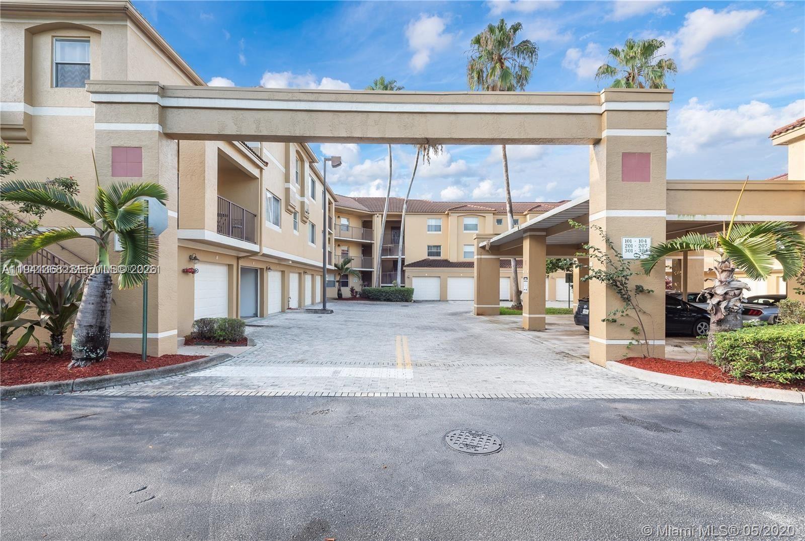 761 North Pine Island Road, Unit 203 Plantation, FL 33324 - Photo 9 of 11 a view of a building with a street