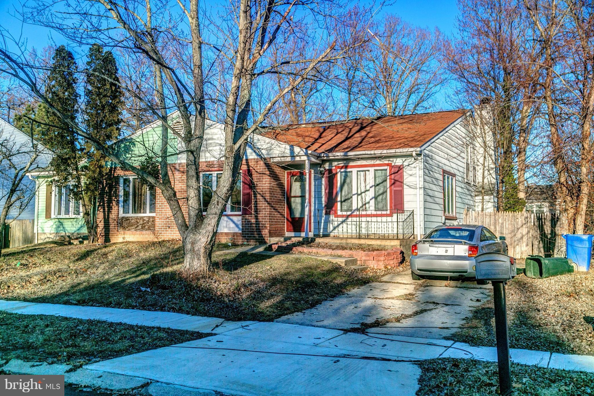 209 Redbud Road Edgewood, MD 21040 - Photo 1 of 30 a front view of a house with garden