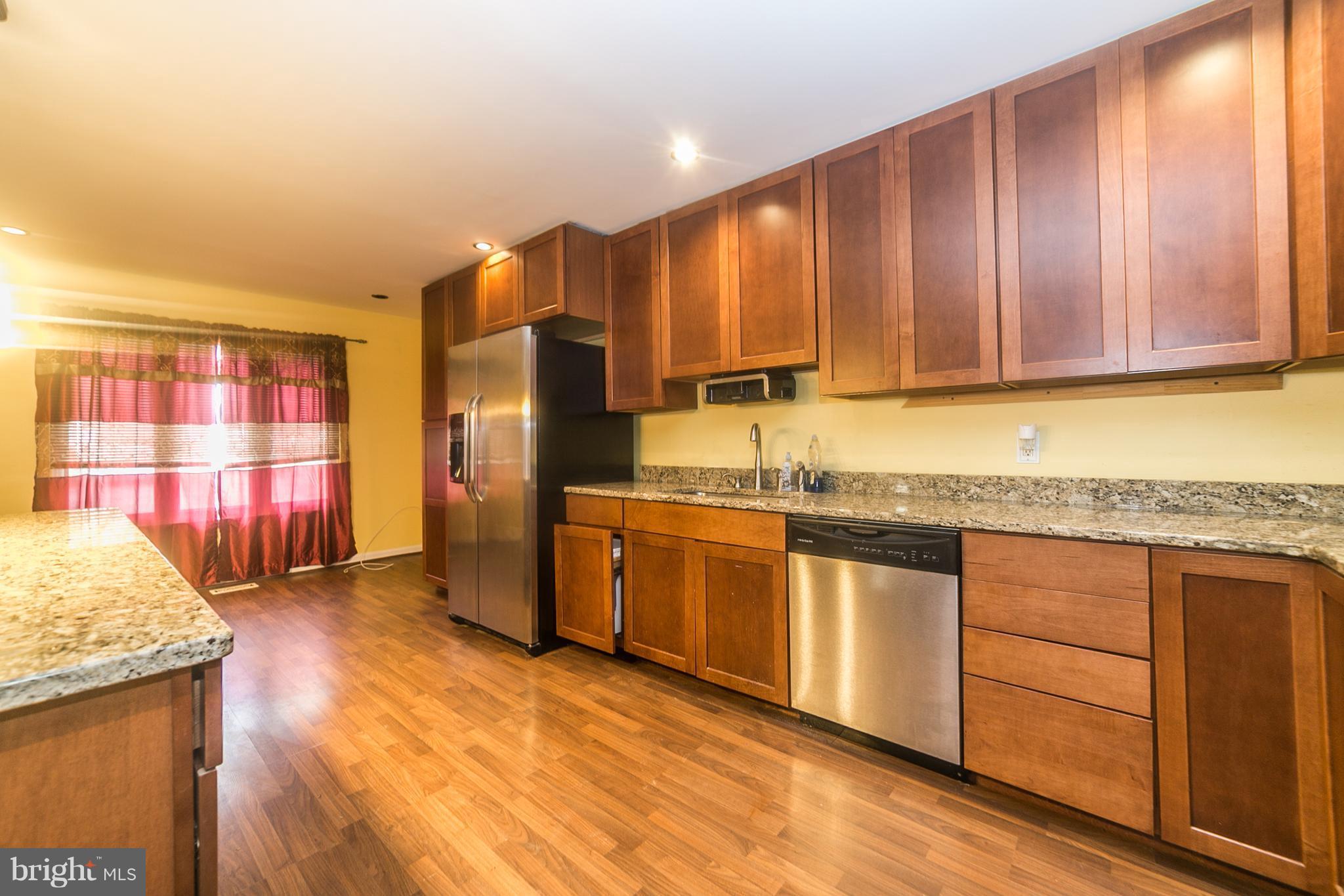209 Redbud Road Edgewood, MD 21040 - Photo 12 of 30 a kitchen with stainless steel appliances granite countertop wooden cabinets a refrigerator and a sink