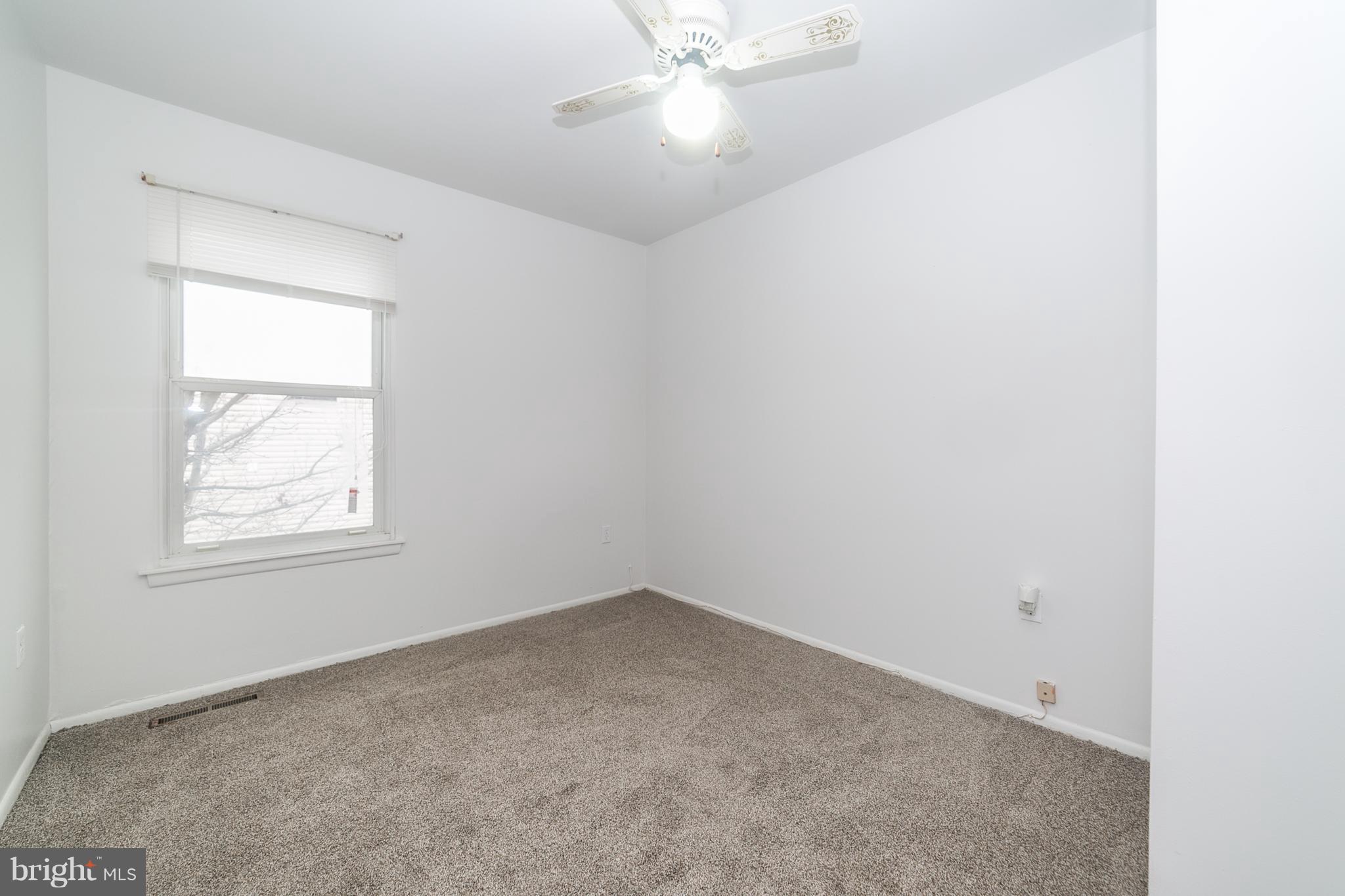 209 Redbud Road Edgewood, MD 21040 - Photo 23 of 30 an empty room with a window and a fan