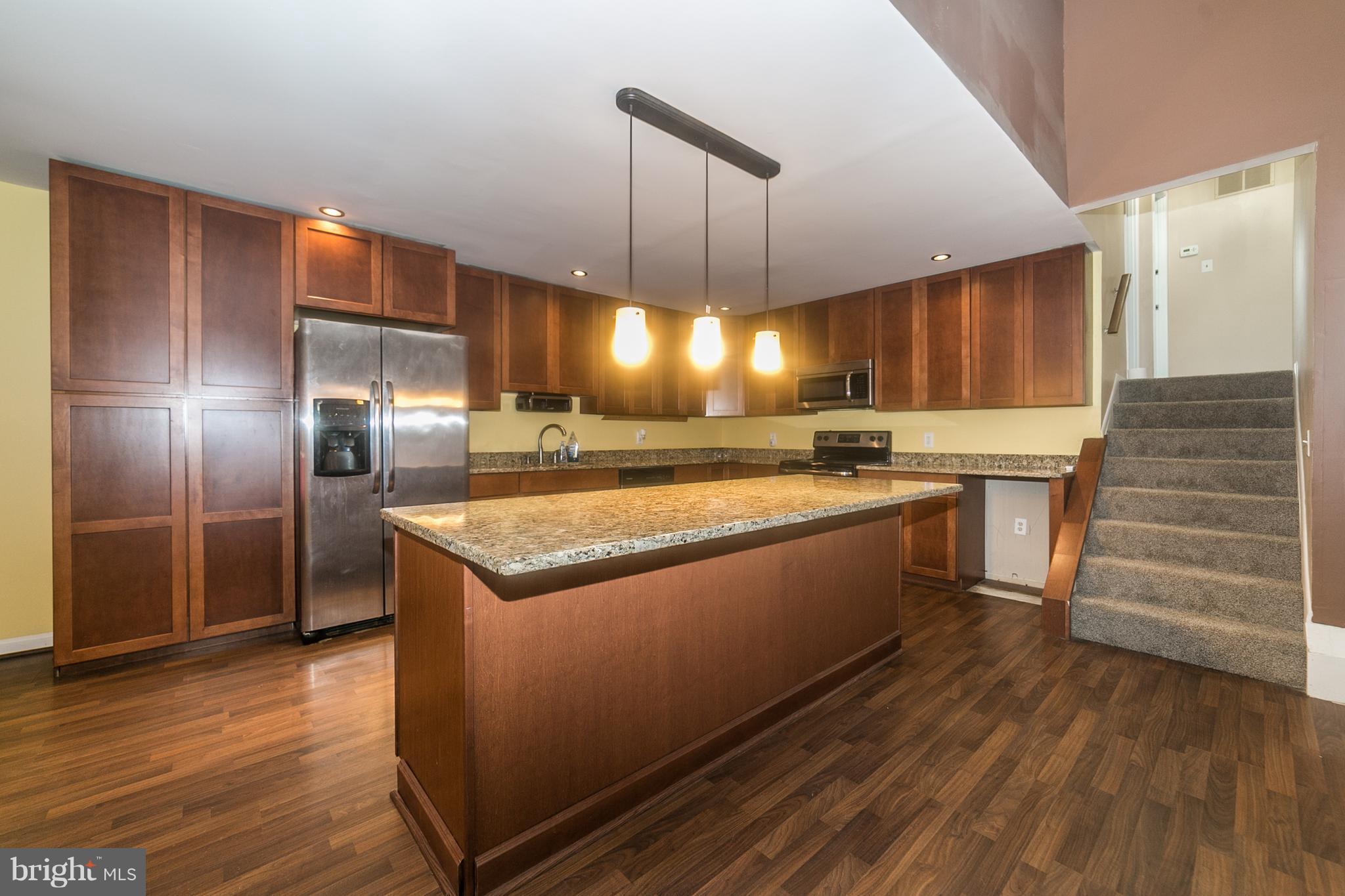 209 Redbud Road Edgewood, MD 21040 - Photo 6 of 30 a kitchen with granite countertop stainless steel appliances a counter top space and cabinets